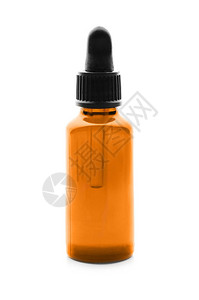 白色背景上的一瓶柑橘精油图片