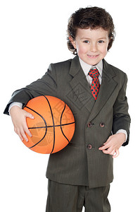 穿着西装的可爱男孩拿着篮球图片