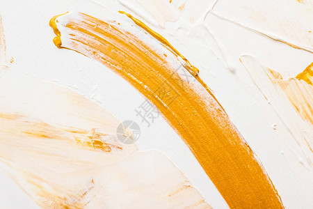 艺术品牌和魅力概念艺术抽象纹理背景金色丙烯酸漆刷笔划纹理油墨溅作为豪华假日品牌的印刷背景背景图片