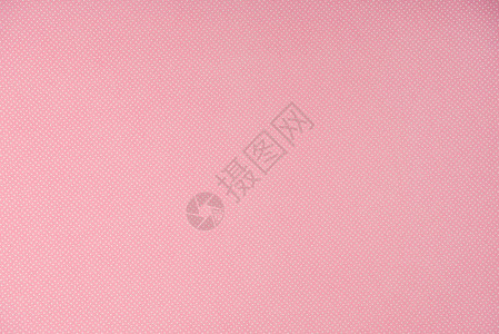 粉红背景上的白色波尔卡背景图片