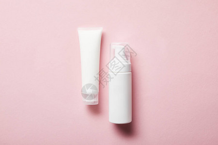 奶油管的顶部视图粉红色有手霜和背景图片