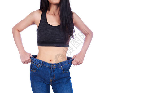 身近身的女子显示体重减瘦穿着白背景孤图片