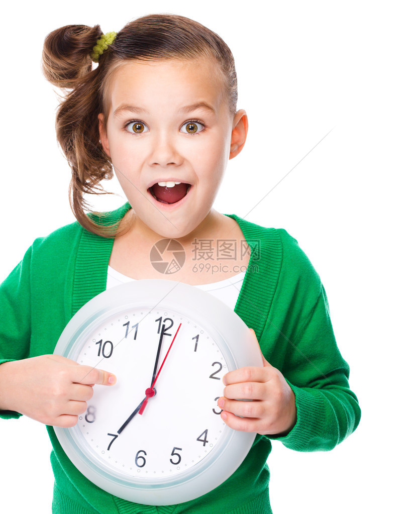 可爱的姑娘拿着大钟表举着沉默的手势孤图片