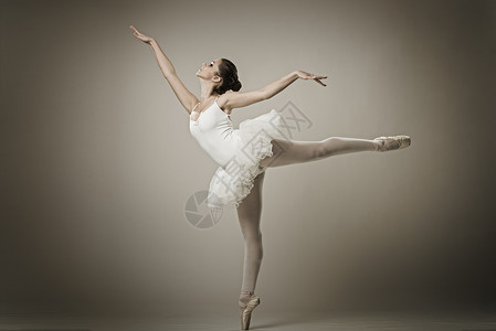舞剧芭蕾舞演员在芭蕾舞姿的肖像背景