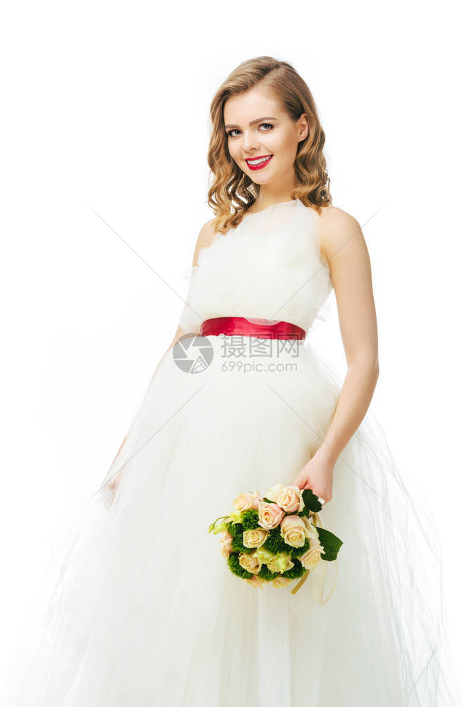 美丽的快乐新娘的肖像与婚礼花束图片