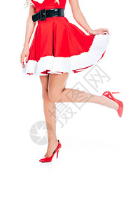 穿着红鞋白背景孤立的高跟鞋的诱惑圣塔女图片