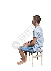 坐在椅子上眼睁地看着白背景的孤立无助的青春整个侧面景图片