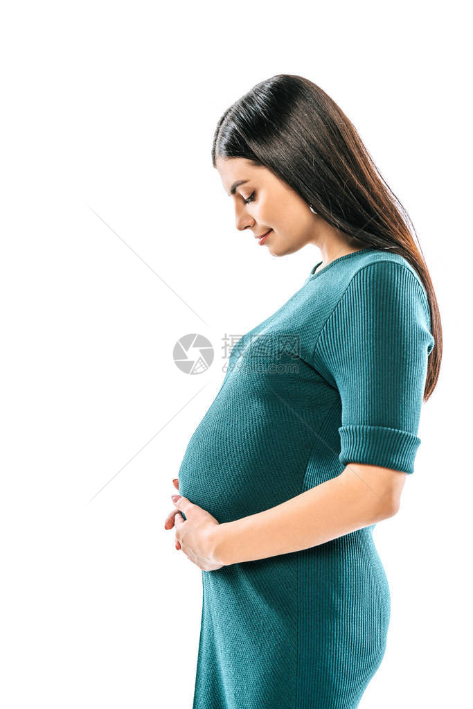 一面笑着的怀孕女孩与腹部图片