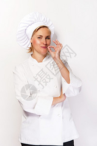 厨艺装扮的女厨师表现出完美的手势并图片