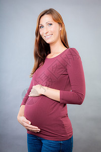 怀孕的女抱着肚子腹部图片