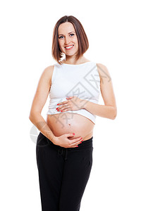 美丽的孕妇拥抱她的肚子与图片