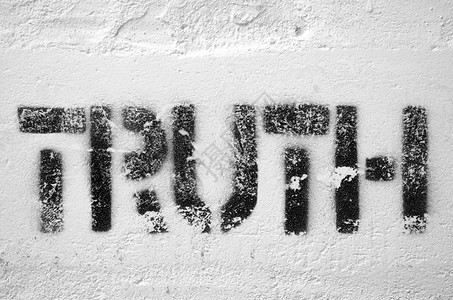 白砖墙上的真理文字了Stenc背景图片