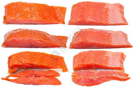 由白色背景上隔离的浅烟熏北极鲑鱼和略咸鳟鱼红尾鱼片组成图片