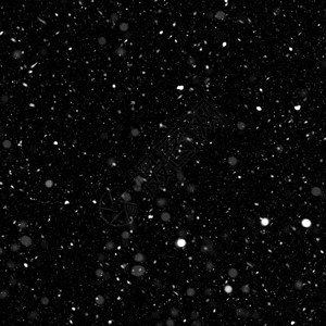 黑色背景下雪的抽象图片