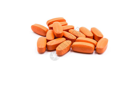 白色背景上的橙色药丸背景图片