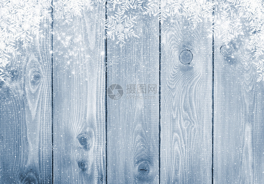 蓝色木质纹理与雪圣诞背景图片