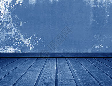 蓝色混凝土墙和木地板图片
