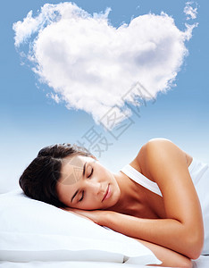 一个年轻女孩的肖像睡在枕头上用高清图片