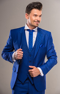 穿着时髦蓝西装和领带的帅哥在图片
