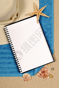 带贝壳海滩毛巾海星帽子和空白写作本图片