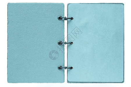 白背景的开放笔记本由织物封面和蓝图片