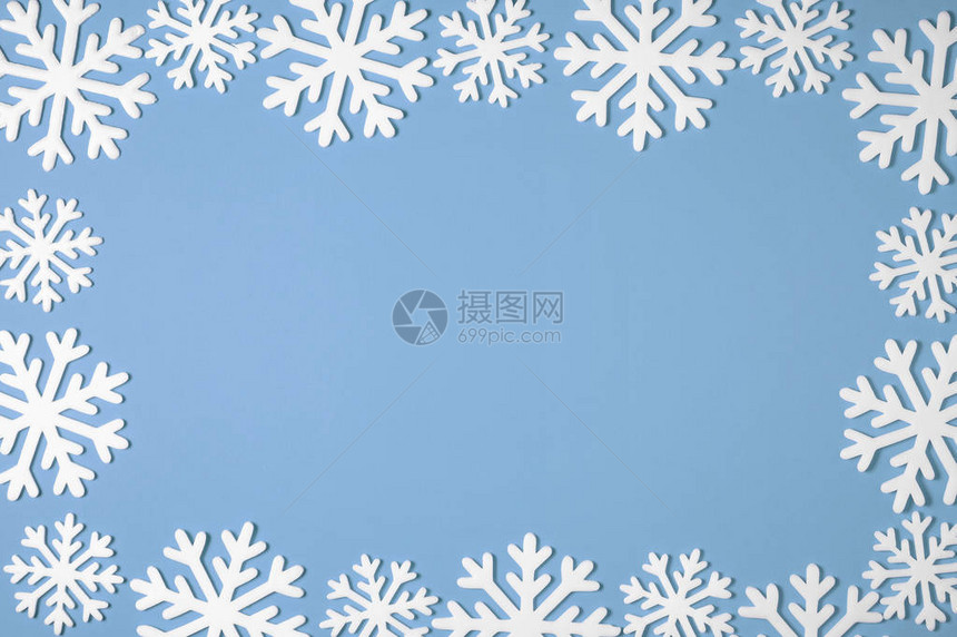 蓝色背景上的圣诞雪花边框Xmas最小纹理图片