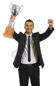 商人赢家与白色背景上的奖杯图片