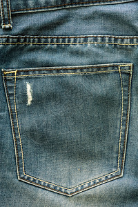 牛仔裤背景结构纹理和口袋有时势破损的织图片