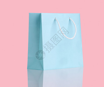 粉红色的蓝色购物袋背景图片