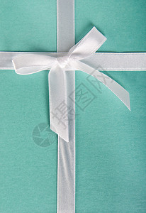 礼盒绿松石白色缎带系在蝴蝶结上图片