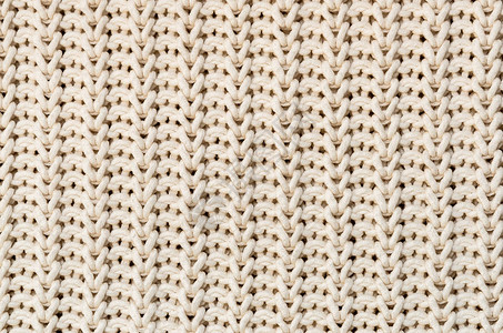 棉白色奶油色手工针织面料的背景图片
