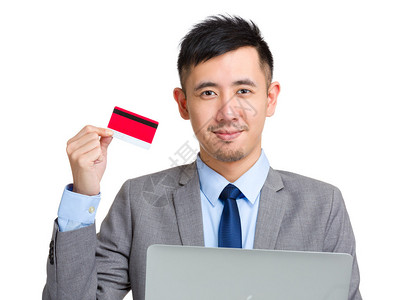 持有信用卡和计算机的商业诉讼公司亚洲英俊背景图片