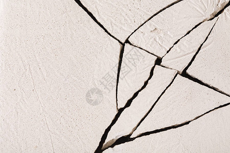 白色混凝土背景旧的碎裂石膏地板顶视图片