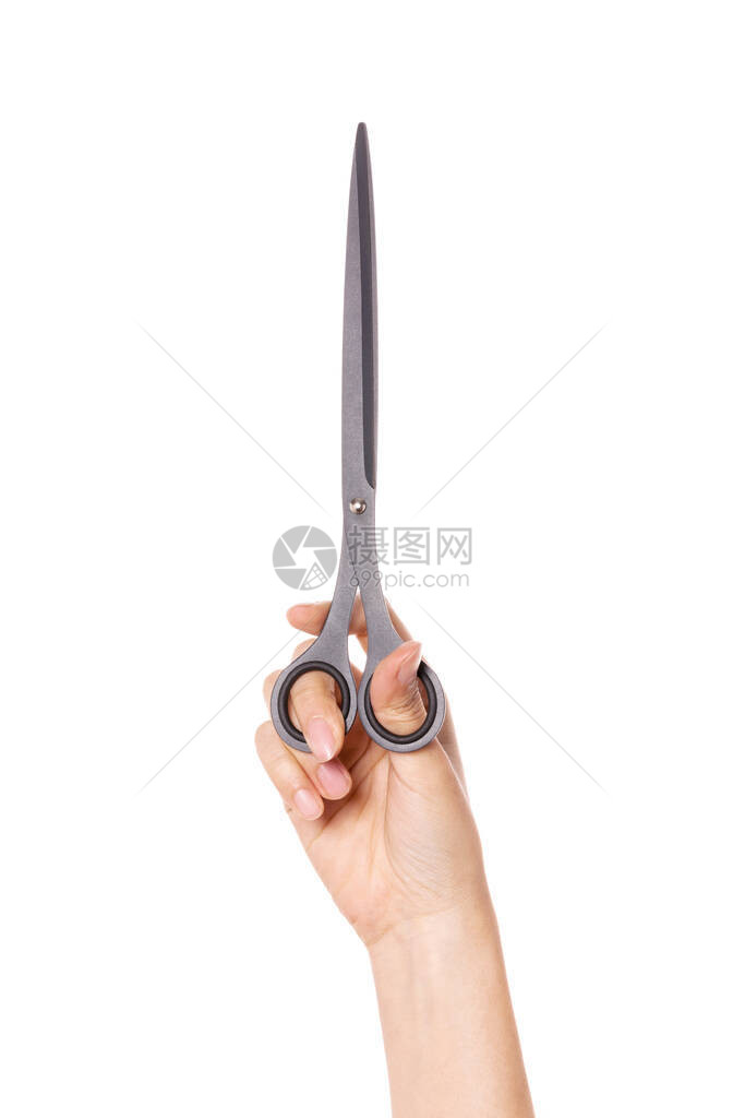 女人手握着长的剪刀在图片