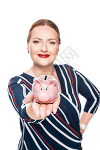 女商人有选择焦点显示粉红猪银行与图片