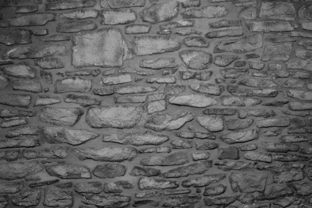 旧石墙的黑白图像图片
