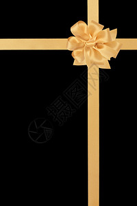 金色缎带与蝴蝶结隔离在黑色背景背景图片