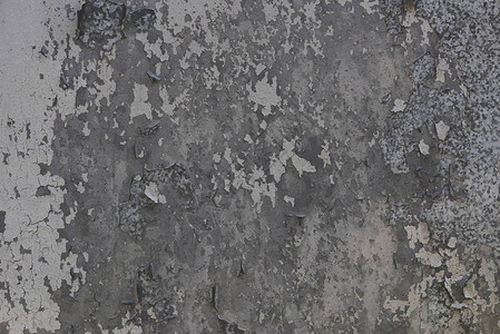 划伤的灰色墙壁纹理背景的特写视图图片