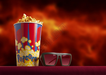 红色扶手椅电影院上的3d眼镜和爆米花轰动一时的概念背景图片