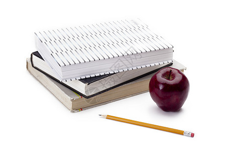 书本和一支代表教育和代表健康的苹果的图片
