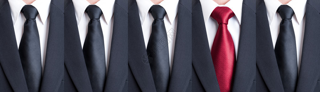 黑色领带之间的红领带超越了模式或人图片