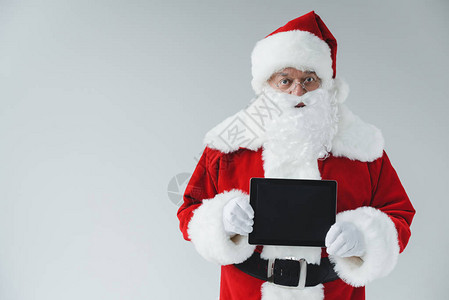 Santa持有数字平板电脑空白图片