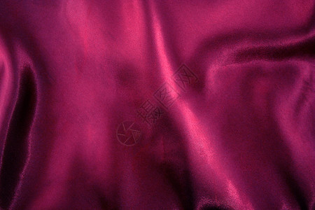 流动的紫色丝绸纹理背景图片