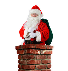 圣诞老人在砖房的烟囱里被紧闭图片