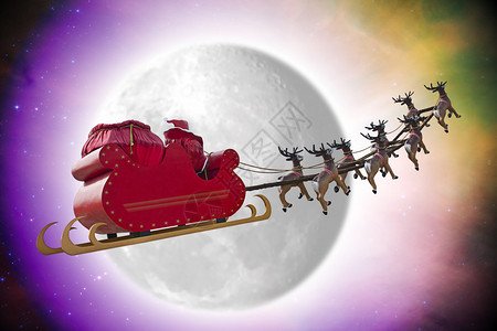 圣诞老人在黄昏的雪橇上骑着雪橇在月亮前经过图片