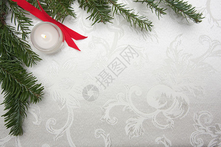 丝绸圣诞背景有蜡烛丝图片