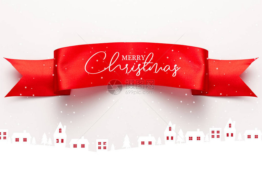 红色带顶部的红色面带与快乐的圣诞礼服在房子和白松树图片