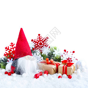 圣诞节配有雪上圣诞卡或新年卡上的格诺梅礼物图片