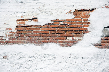 旧砖墙与破旧的白色石膏图片