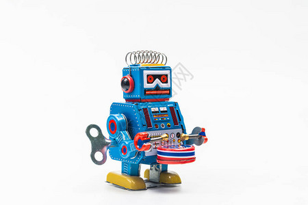 白色背景上的机器人锡玩具背景图片